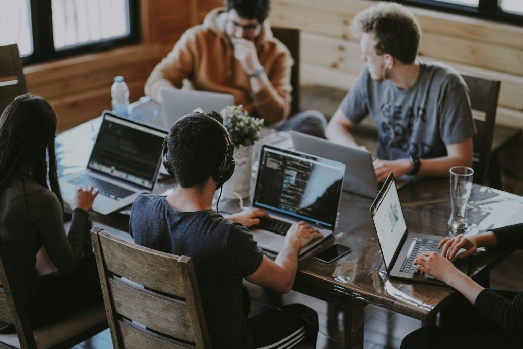 Support team collaborating around a shared workspace